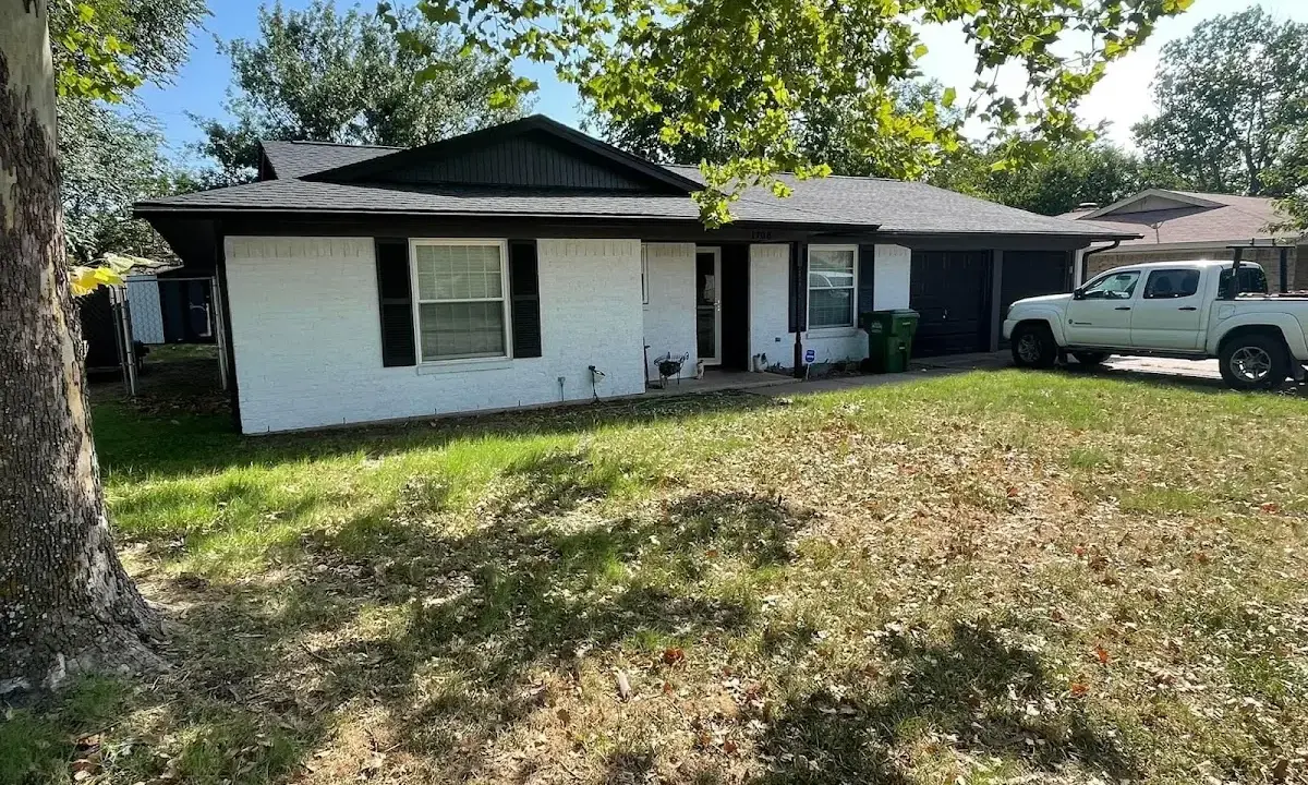 Professional roofing crew working on a residential roof in Kennewick